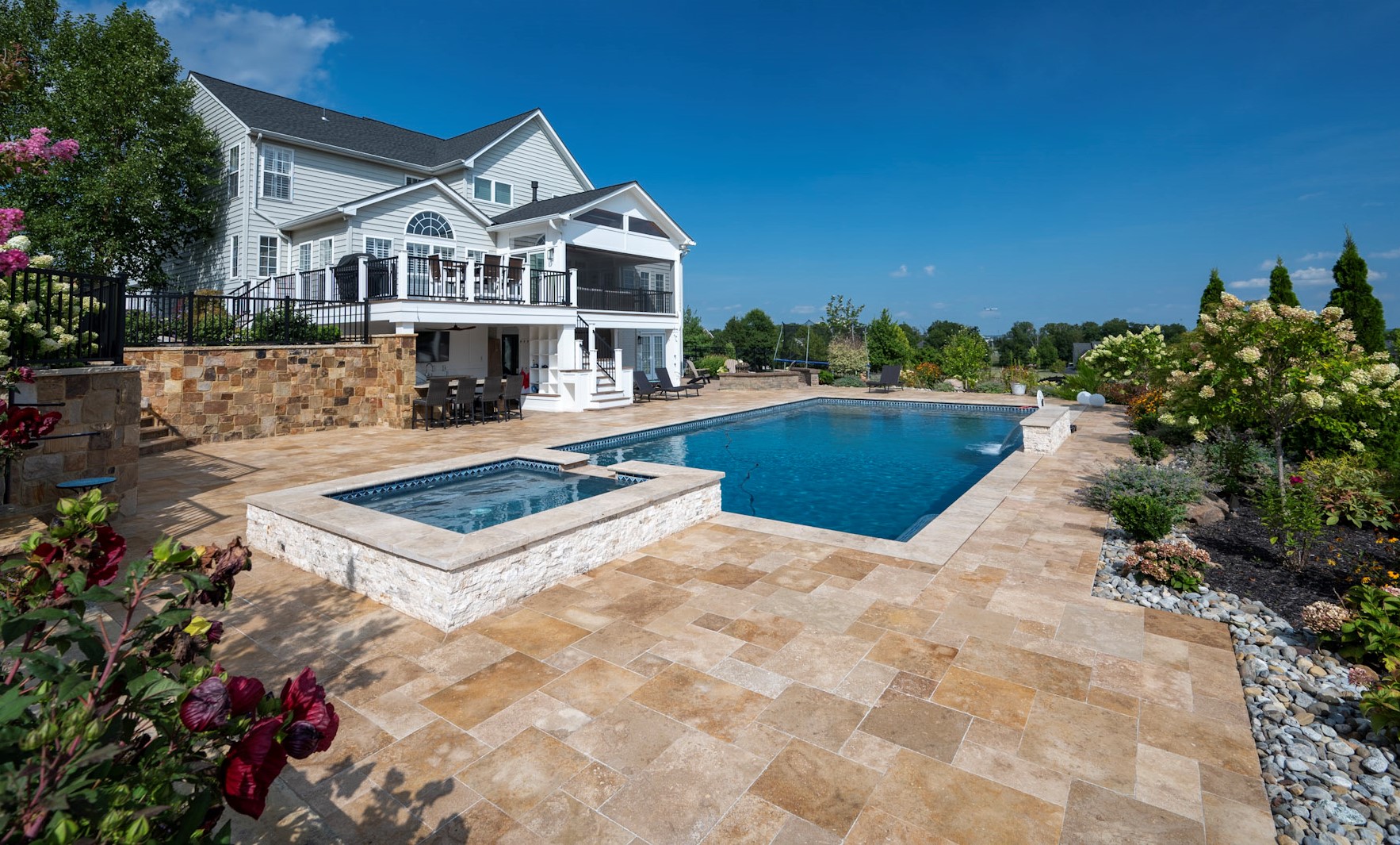 Custom pool with travertine decking
